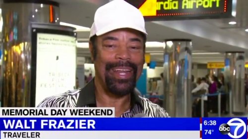Ordinary Memorial Day weekend traveler Walt 'Clyde' Frazier talks to local news in zebra shirt