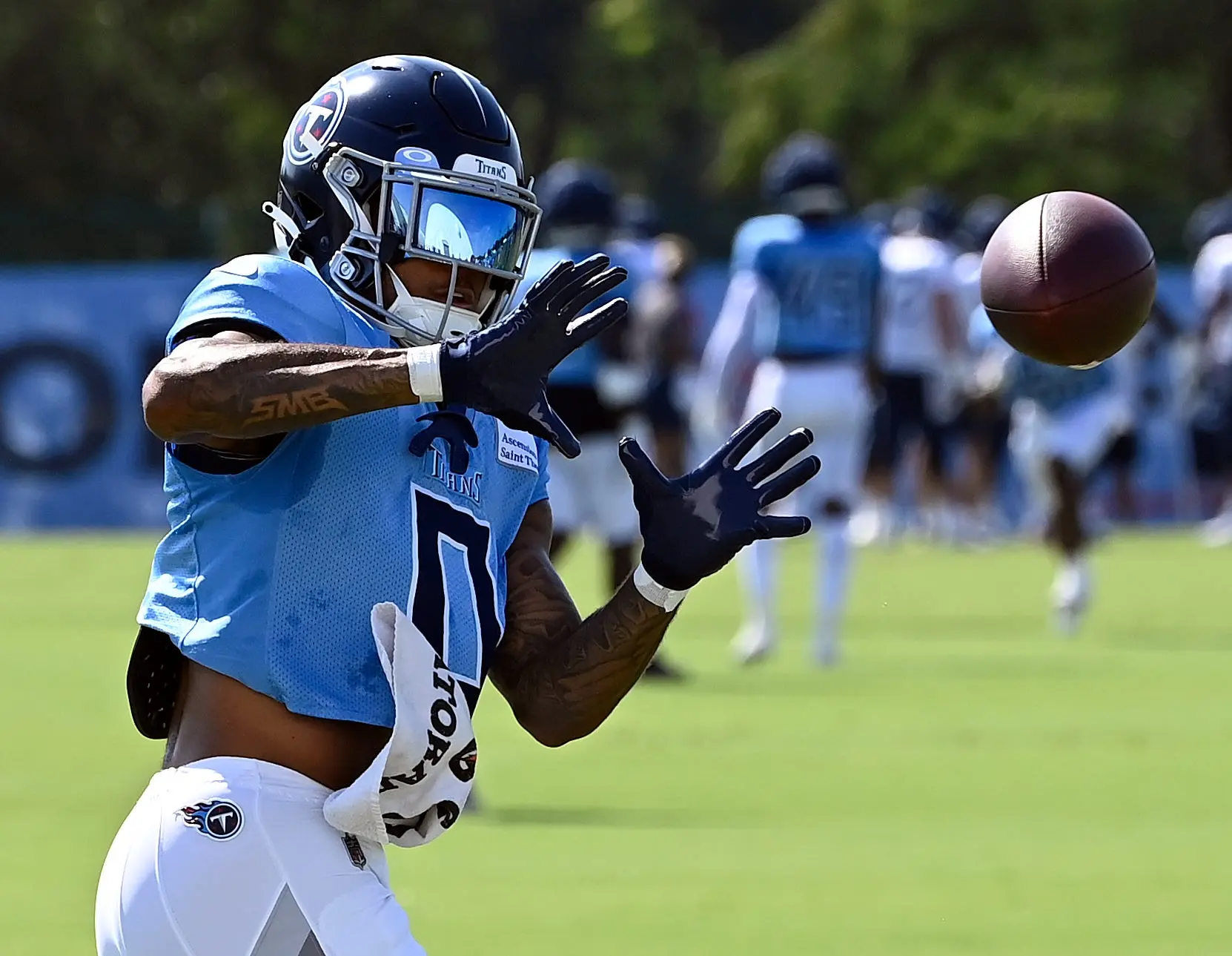 Titans' Treylon Burks carted off from practice with apparent leg injury