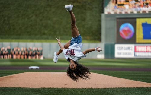 Suni Lee threw in an effortless flip on her first pitch for the Twins because she can