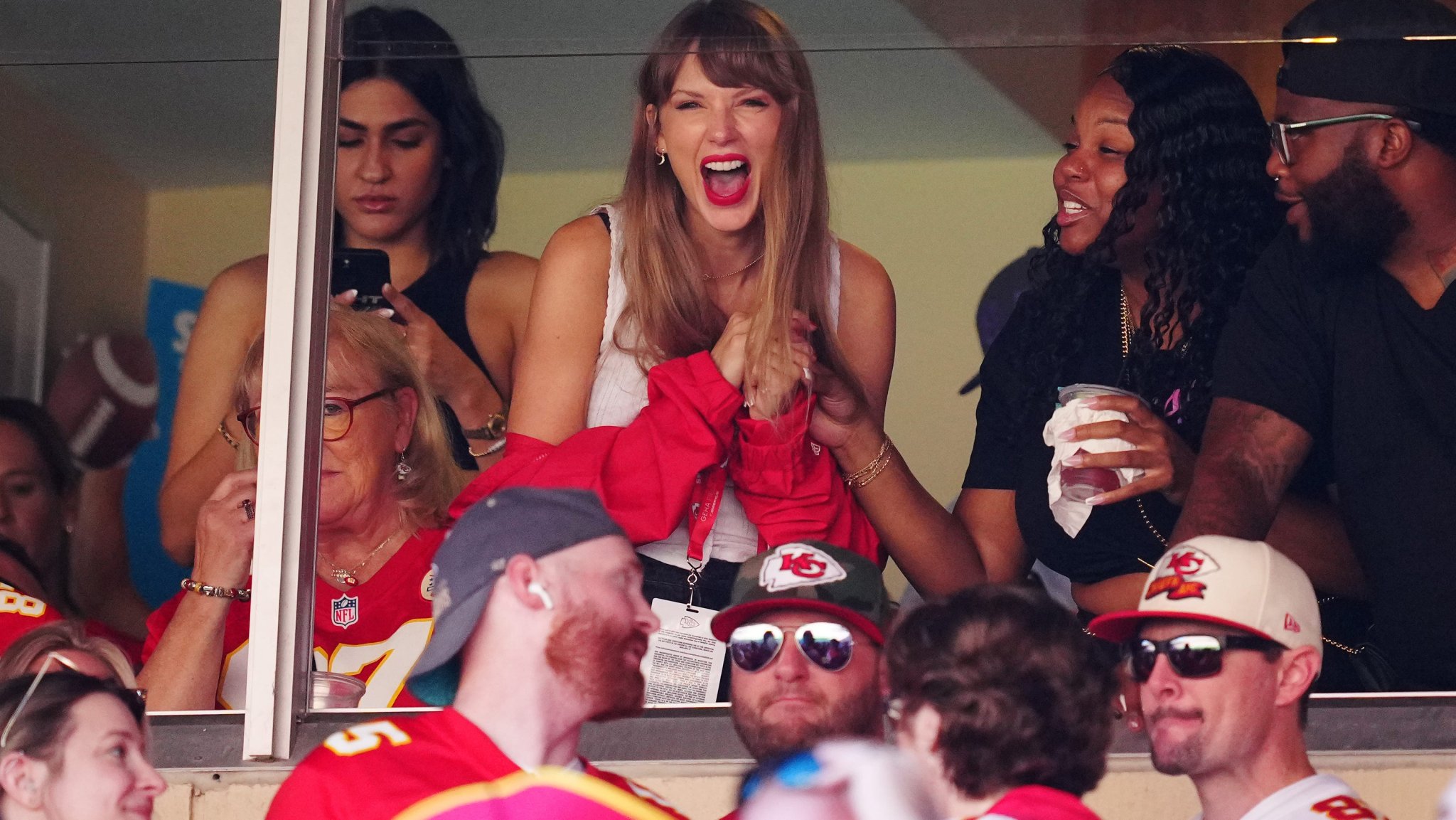 Taylor Swift, Travis Kelce exit Chiefs game together and drive away in convertible