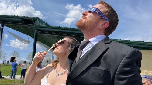 Elope at the eclipse: Watch over 100 couples tie the knot in mass eclipse wedding