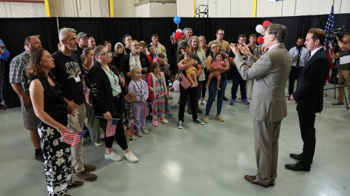 White South Africans arrive in US. Trump's 'genocide' claim disputed.