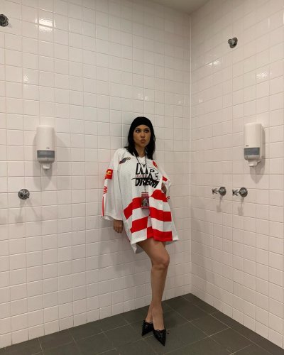 Kourtney Kardashian Embraces the ‘Chaos’ at Travis Barker’s Concert in a Hockey Jersey and Heels