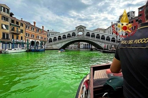 Venice's Waters Turn Fluorescent Green Near Rialto Bridge
