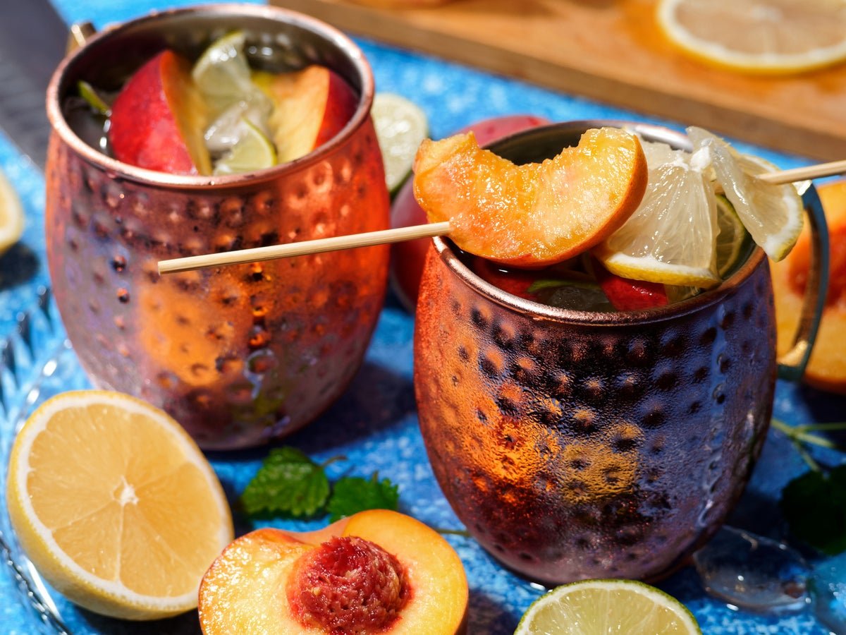 Yellow Peach Moscow Mules Are the Summer Cocktail You Didn't Know You Needed