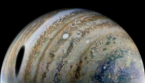 The shadow of Jupiter’s largest moon looms in a gorgeous new Juno photo