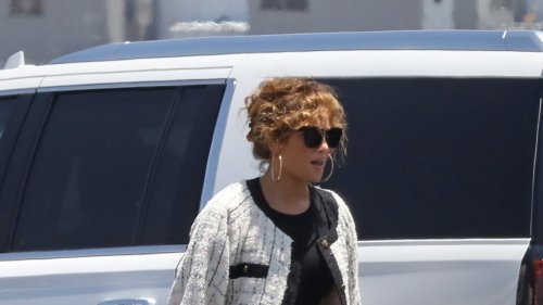 When You’re Jennifer Lopez, You Wear A Chanel Suit & Platform Boots On A Flight