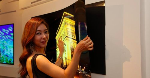 LG’s 55-inch 'wallpaper' OLED display hangs on the wall with magnets