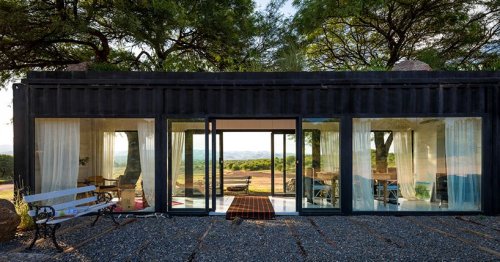 Glass-walled shipping container makes scenic shelter in Argentina