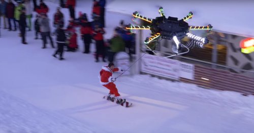 Watch a human-carrying drone lift a snowboarder off a mountain