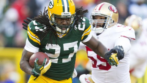 Eddie Lacy bowls over Donte Whitner