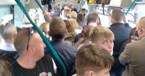 'They were still trying to ram more on': Onboard a packed train