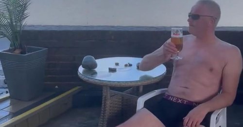 Man keeps drinking beer in his pants as huge waves flood pub terrace