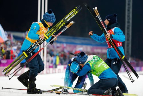 Ukraine biathlon team wins a gold medal, honors countrymen back home