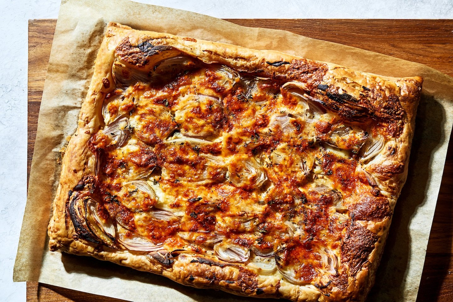 Frozen puff pastry is the key to the quick cheese and onion tart of your dreams