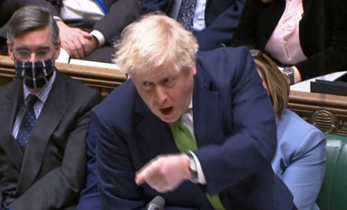 Britain’s scandal-hit Boris Johnson lifts coronavirus restrictions, battles to save premiership