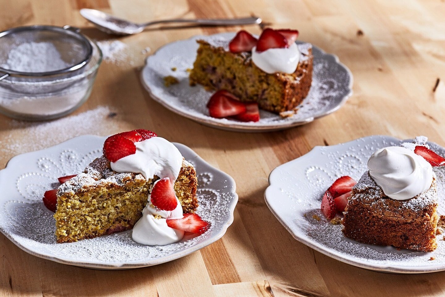With their powers combined, strawberries, pistachios and olive oil make for one splendid cake