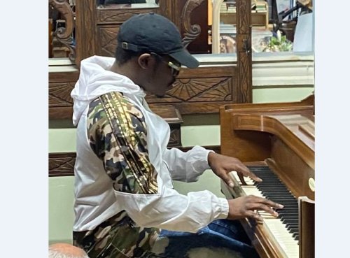 He asked to play a piano at a store. His performance went viral, and the owner gave him his first piano.
