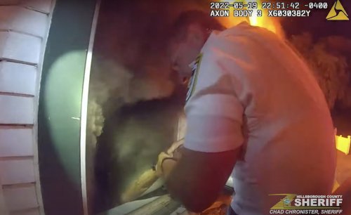 Body-cam video shows tense 4-minute rescue of boy stuck in burning home