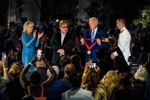 Elton John ‘flabbergasted’ and teary after Biden surprises him with medal
