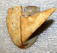 Long-nosed god maskette - Wikipedia