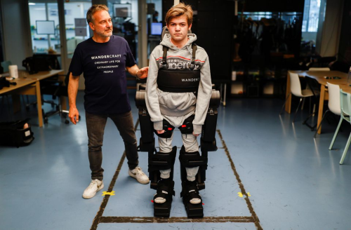 Father builds exoskeleton suit to help his son and others walk for the first time