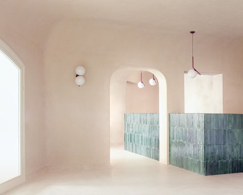 studio wok combines granite formations with Sardinian earth tones for Myrto Restaurant in Italy