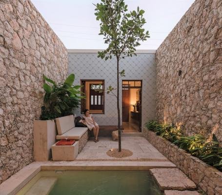 El Nido House by Taller Estilo Arquitectura is super narrow house featuring mini courtyard and pool