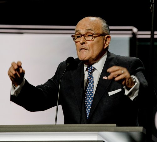 Footage shows the "life-threatening" tap on Rudy Giuliani's back by market employee