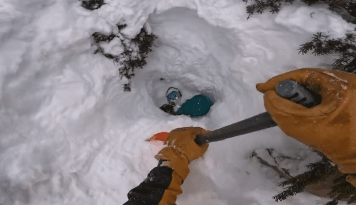 Watch Skier Rescue Snowboarder Buried Headfirst In Several Feet Of Snow