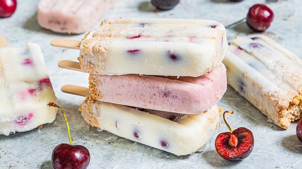 Fresh Cherry Cheesecake Popsicles with Cookie Crumble
