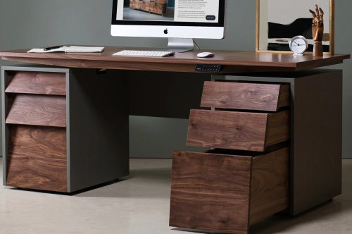 This sit-stand desk perfectly fuses the good looks of traditional writing desks with modern ergonomic comfort