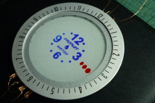 Unique DIY watch moves liquid droplets around to tell the time