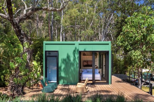 This tiny home in Brazil coated in bright colors inside and out is formed from two disused shipping containers!