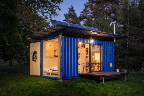 This tiny house is actually a clean energy powered, self-sufficient, repurposed shipping container!
