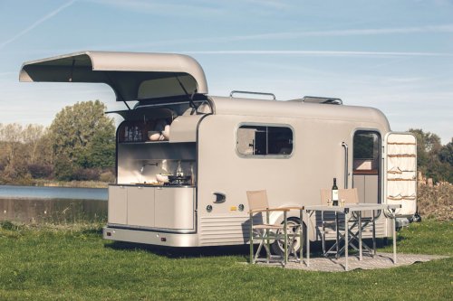 This solar camper trailer comes equipped with a full kitchen + a retractable roof for star-gazing!