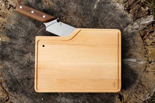 This travel cutting board with a built-in knife cuts out the stress of food prep on the go