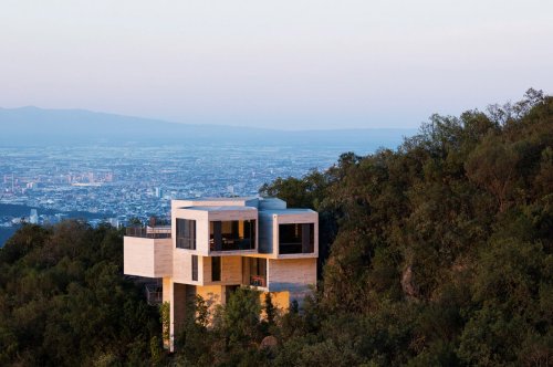 This raw + rugged concrete home floats on top of a hill in Mexico