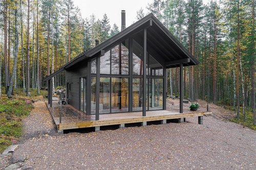 This prefabricated cabin is a holiday retreat that balances a rustic personality with modern details!