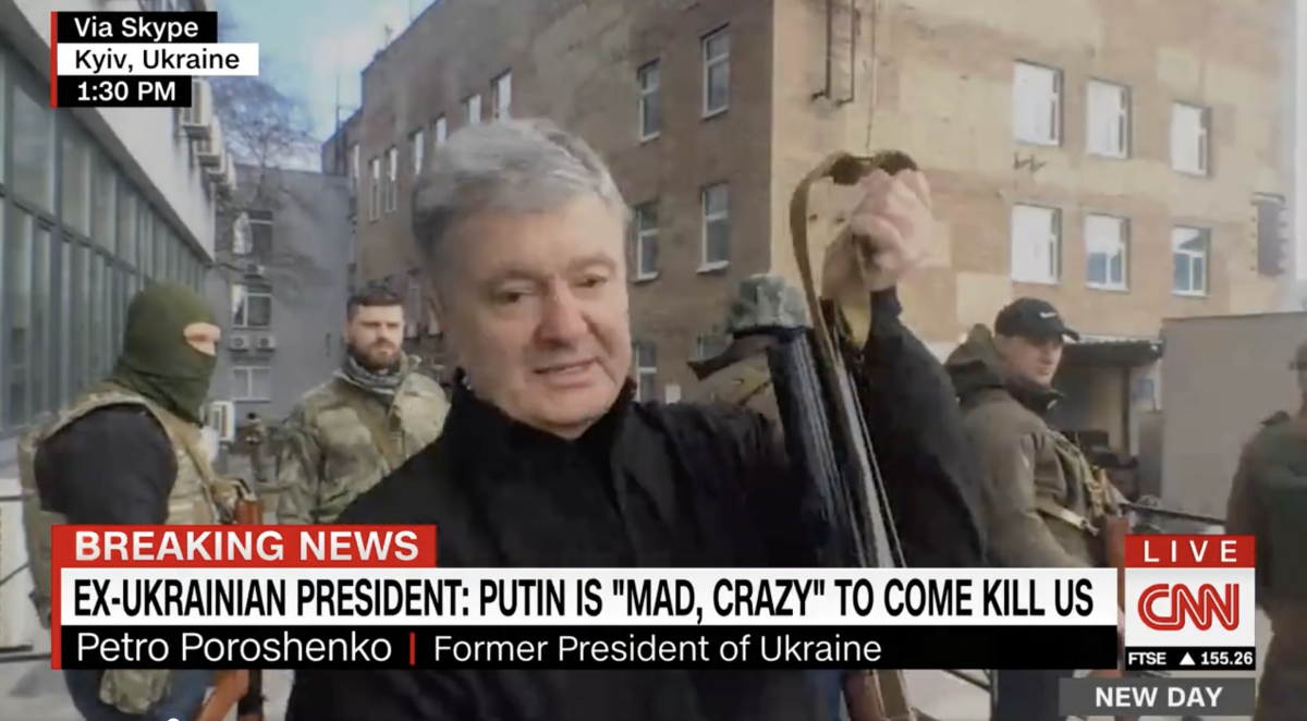 'We hate Putin': Moment ex-president brandishes Kalashnikov rifle on streets of Ukraine