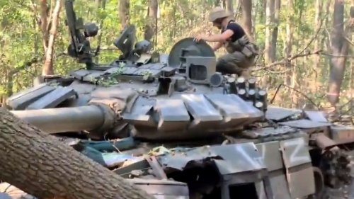 Ukrainian Soldiers Discover Damaged Russian Tank And Claim It As Trophy